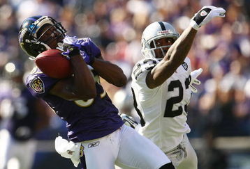 BALTIMORE - OCTOBER 26: Derrick Mason #85 of the Baltimore Ravens makes a catch under pressure from DeAngelo Hall #23 of the Oakland Raiders during the game at M&T Bank Stadium October 26, 2008 in Baltimore, Maryland.  (Photo by Chris McGrath/Getty Images)