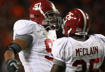 AUBURN, AL - NOVEMBER 24:  Defensive lineman Lorenzo Washington #97 and Rolando McClain #25 of the Alabama Crimson Tide celebrate after sacking quarterback Brandon Cox #12 of the Auburn Tigers at Jordan-Hare Stadium on November 24, 2007 in Auburn, Alabama. (Photo by Doug Benc/Getty Images)