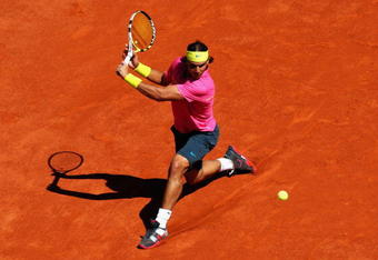 PARIS - MAY 29:  Rafael Nadal of Spain hits a backhand during his Men's Singles Third Round match against Lleyton Hewitt of Australia on day six of the French Open at Roland Garros on May 29, 2009 in Paris, France.  (Photo by Ryan Pierse/Getty Images)
