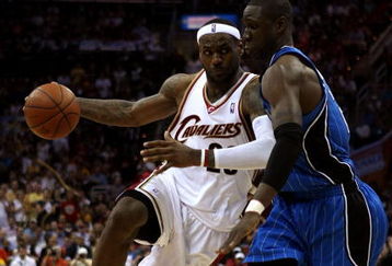 CLEVELAND - MAY 28: LeBron James #23 of the Cleveland Cavaliers drives to the hoop against Mickael Pietrus #20 of the Orlando Magic in Game Five of the Eastern Conference Finals during the 2009 Playoffs at Quicken Loans Arena on May 28, 2009 in Cleveland, Ohio. NOTE TO USER: User expressly acknowledges and agrees that, by downloading and or using this photograph, User is consenting to the terms and conditions of the Getty Images License Agreement  (Photo by Elsa/Getty Images)
