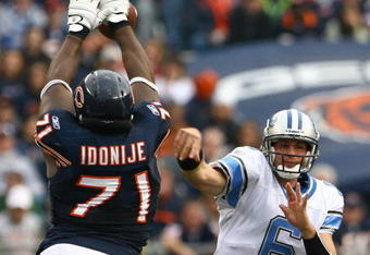 CHICAGO - NOVEMBER 02:  Lineman Israel Idonije #71 of the Chicago Bears blocks a pass from quarterback Dan Orlovsky #6 of the Detroit Lions during the fourth quarter at Soldier Field on November 2, 2008 in Chicago, Illinois. The Bears defeated the Lions 27-23.  (Photo by Jeff Gross/Getty Images)