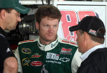 DOVER, DE - MAY 29:  Dale Earnhardt Jr. (C), driver of the #88 AMP Energy/National Guard Chevrolet, talks with interim crew chief Brian Whitesell (R) and a crew member in the garage during practice for the NASCAR Sprint Cup Series Autism Speaks 400 at Dover International Speedway on May 29, 2009 in Dover, Delaware.  (Photo by Nick Laham/Getty Images)