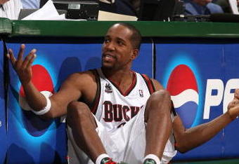 MILWAUKEE - JANUARY 22:  Michael Redd #22 of the Milwaukee Bucks gestures as he sits next to the scorer's table against the Phoenix Suns at the Bradley Center on January 22, 2008 in Milwaukee, Wisconsin. The Suns won 114-105. NOTE TO USER: User expressly acknowledges and agrees that, by downloading and/or using this Photograph, user is consenting to the terms and conditions of the Getty Images License Agreement.  (Photo by Jonathan Daniel/Getty Images)