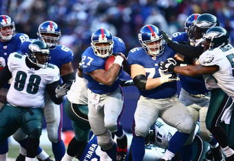EAST RUTHERFORD, NJ -  JANUARY 11:  Brandon Jacobs #27 of the New York Giants runs the ball against the Philadelphia Eagles during the NFC Divisional Playoff Game on January 11, 2009 at Giants Stadium in East Rutherford, New Jersey.  The Eagles defeated the Giants 23 -11. (Photo by Chris McGrath/Getty Images)