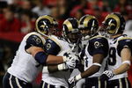 ATLANTA - DECEMBER 28:  Running back Steven Jackson #39 of the St. Louis Rams is congratulated by tackle Adam Goldberg #73, wide receivers Donnie Avery #17 and Dane Looker #89 after Jackson scored against the Atlanta Falcons at Georgia Dome on December 28, 2008 in Atlanta, Georgia.  (Photo by Doug Benc/Getty Images)