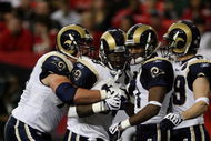 ATLANTA - DECEMBER 28: Running back Steven Jackson #39 of the St. Louis Rams is congratulated by tackle Adam Goldberg #73, wide receivers Donnie Avery #17 and Dane Looker #89 after Jackson scored against the Atlanta Falcons at Georgia Dome on December 28, 2008 in Atlanta, Georgia. (Photo by Doug Benc/Getty Images)
