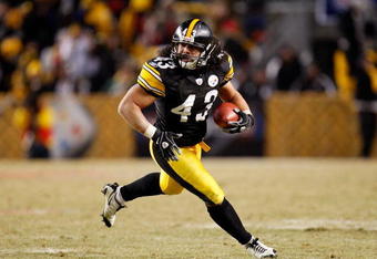 PITTSBURGH - JANUARY 18:  Troy Polamalu #43 of the Pittsburgh Steelers returns an interception 40 yards for a touchdown against the Baltimore Ravens during the fourth quarter of the AFC championship game on January 18, 2009 at Heinz Field in Pittsburgh, Pennsylvania.  (Photo by Gregory Shamus/Getty Images)