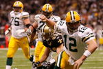 NEW ORLEANS - NOVEMBER 24:  Quarterback Aaron Rodgers #12 of the Green Bay Packers celebrates after scoring a touchdown in the second quarter against the New Orleans Saints on November 24, 2009 at the Superdome in New Orleans, Louisiana.  (Photo by Chris Graythen/Getty Images)