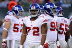 EAST RUTHERFORD, NJ - AUGUST 23:  Osi Umenyiora #72 of the New York Giants waits during a timeout against the New York Jets during a preseason NFL game at Giants Stadium in the Meadowlands on August 23, 2008 in East Rutherford, New Jersey.  (Photo by Jeff Zelevansky/Getty Images) 