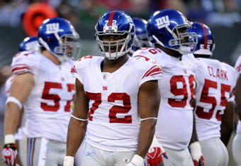EAST RUTHERFORD, NJ - AUGUST 23:  Osi Umenyiora #72 of the New York Giants waits during a timeout against the New York Jets during a preseason NFL game at Giants Stadium in the Meadowlands on August 23, 2008 in East Rutherford, New Jersey.  (Photo by Jeff Zelevansky/Getty Images) 
