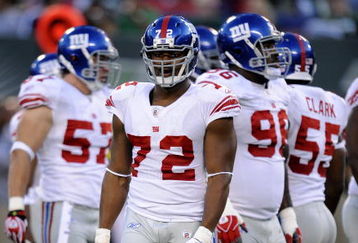EAST RUTHERFORD, NJ - AUGUST 23:  Osi Umenyiora #72 of the New York Giants waits during a timeout against the New York Jets during a preseason NFL game at Giants Stadium in the Meadowlands on August 23, 2008 in East Rutherford, New Jersey.  (Photo by Jeff Zelevansky/Getty Images) 