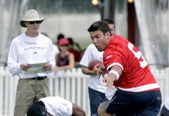 PITTSFORD, NY - JULY 25: Trent Edwards #5 of the Buffalo Bills hands off to Marshawn Lynch #23 who stubbles as head coach Dick Jauron watches during Training Camp on July 25, 2008 at Saint John Fisher College in Pittsford, New York.  (Photo by Rick Stewart/Getty Images)