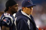 FOXBORO, MA - AUGUST 7:  Randy Moss #81 and Tom Brady #12 of the New England Patriots watch the game on the sidelines against the Baltimore Ravens during a preseason game at Gillette Stadium on August 7, 2008 in Foxboro, Massachusetts. (Photo by Jim Rogash/Getty Images)