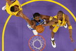 LOS ANGELES, CA - MAY 21:  Nene #31 of the Denver Nuggets goes to the basket against Andrew Bynum #17 and Kobe Bryant #24 of the Los Angeles Lakers in Game Five of the Western Conference Finals during the 2009 NBA Playoffs at Staples Center on May 27, 2009 in Los Angeles, California. NOTE TO USER: User expressly acknowledges and agrees that, by downloading and or using this photograph, User is consenting to the terms and conditions of the Getty Images License Agreement. (Photo by Kevork Djansezian/Getty Images)