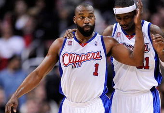LOS ANGELES, CA - FEBRUARY 18:  Baron Davis #1 of the Los Angeles Clippers consoles Ricky Davis #31 during their , 142-119, loss to the Phoenix Suns at the Staples Center February 18, 2009, in Los Angeles, California. NOTE TO USER: User expressly acknowledges and agrees that, by downloading and or using this photograph, User is consenting to the terms and conditions of the Getty Images License Agreement.  (Photo by Kevork Djansezian/Getty Images)