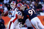 DENVER - DECEMBER 21:  Offensive tackle Kirk Chambers #73 of the Buffalo Bills blocks the rush of Ebenezer Ekuban #91 of the Denver Broncos as he protects quarterback Trent Edwards #5 at Invesco Field at Mile High on December 21, 2008 in Denver, Colorado. The Bills defeated the Broncos 30-23.  (Photo by Doug Pensinger/Getty Images)