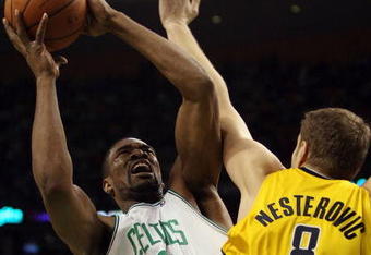 BOSTON - FEBRUARY 27:  Leon Powe #0 of the Boston Celtics takes a shot as Rasho Nesterovic #8 of the Indiana Pacers defends on February 27, 2009 at TD Banknorth Garden in Boston, Massachusetts. NOTE TO USER: User expressly acknowledges and agrees that, by downloading and or using this Photograph, user is consenting to the terms and conditions of the Getty Images License Agreement.  (Photo by Elsa/Getty Images)