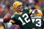 GREEN BAY, WI - NOVEMBER 30:  Aaron Rodgers #12 of the Green Bay Packers throws a pass against the Carolina Panthers at Lambeau Field on November 30, 2008 in Green Bay, Wisconsin.  (Photo by Jonathan Daniel/Getty Images)