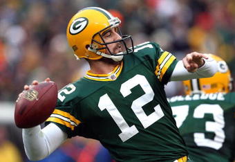 GREEN BAY, WI - NOVEMBER 30:  Aaron Rodgers #12 of the Green Bay Packers throws a pass against the Carolina Panthers at Lambeau Field on November 30, 2008 in Green Bay, Wisconsin.  (Photo by Jonathan Daniel/Getty Images)