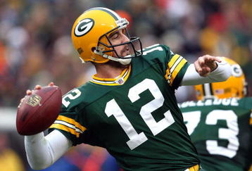 GREEN BAY, WI - NOVEMBER 30:  Aaron Rodgers #12 of the Green Bay Packers throws a pass against the Carolina Panthers at Lambeau Field on November 30, 2008 in Green Bay, Wisconsin.  (Photo by Jonathan Daniel/Getty Images)