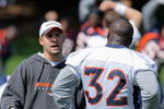 ENGLEWOOD, CO - MAY 03:  Head coach Josh McDaniels of the Denver Broncos chats with running back LaMont Jordan #32 during minicamp at the Broncos training facility on May 3, 2009 in Englewood, Colorado.  (Photo by Doug Pensinger/Getty Images)
