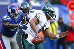 EAST RUTHERFORD, NJ - JANUARY 11:  Quarterback Donovan McNabb #5 of the Philadelphia Eagles scrambles in the pocket during the NFC Divisional Playoff Game against the New York Giants on January 11, 2009 at Giants Stadium in East Rutherford, New Jersey.  The Eagles defeated the Giants 23-11. (Photo by Al Bello/Getty Images)