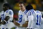 PITTSBURGH, PA - OCTOBER 21:   Quarterback Peyton Manning #18 of the Indianapolis Colts goes over the playbook during the NFL game against the Pittsburgh Steelers at Heinz Field on October 21, 2002 in Pittsburgh, Pennsylvania. Pittsburgh won 28-10.(Photo by Rick Stewart/Getty Images)