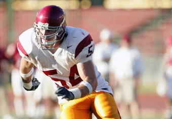 PALO ALTO, CA - SEPTEMBER 25:  Jeff Schweiger #54 of the USC Trojans rushes the quarterback during the game against the Stanford Cardinal on September 25, 2004 at Stanford Stadium in Palo Alto, California.  USC defeated Stanford 31-28. (Photo by Stephen Dunn/Getty Images)