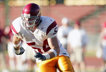 PALO ALTO, CA - SEPTEMBER 25:  Jeff Schweiger #54 of the USC Trojans rushes the quarterback during the game against the Stanford Cardinal on September 25, 2004 at Stanford Stadium in Palo Alto, California.  USC defeated Stanford 31-28. (Photo by Stephen Dunn/Getty Images)