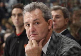 VANCOUVER - SEPTEMBER 30:  Head Coach Darryl Sutter of the Calgary Flames looks on against the Vancouver Canucks during their pre-season NHL game at General Motors Place on September 30, 2005 in Vancouver, Canada.   (Photo by Jeff Vinnick/Getty Images)