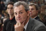 VANCOUVER - SEPTEMBER 30:  Head Coach Darryl Sutter of the Calgary Flames looks on against the Vancouver Canucks during their pre-season NHL game at General Motors Place on September 30, 2005 in Vancouver, Canada.   (Photo by Jeff Vinnick/Getty Images)