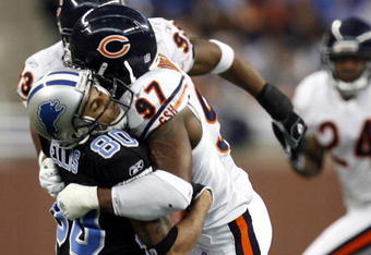 DETROIT - DECEMBER 24:  Mark Anderson #97 of the Chicago Bears tackles Devale Ellis #80 of the Detroit Lions for a loss on December 24, 2006 at Ford Field in Detroit, Michigan.  (Photo by Gregory Shamus/Getty Images)