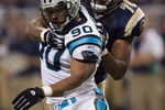 ST. LOUIS, MO - SEPTEMBER 9:  Julius Peppers #90 of the Carolina Panthers is grabbed from behind by Alex Barron #70 of the St. Louis Rams during the NFL game on September 9, 2007 at the Edward Jones Dome in St. Louis, Missouri.  The Panthers beat the Rams 27-13.  (Photo by Dilip Vishwanat/Getty Images)