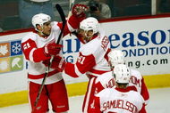 CHICAGO - MAY 24: Valtteri Filppula #51 of the Detroit Red Wings celebrates with Marian Hossa #81, Tomas Holmstrom #96 and Mikael Samuelsson #37 after Filppula scored a goal in the second period against the Chicago Blackhawks during Game Four of the Western Conference Championship Round of the 2009 Stanley Cup Playoffs on May 24, 2009 at the United Center in Chicago, Illinois. (Photo by Jim Prisching/Getty Images)
