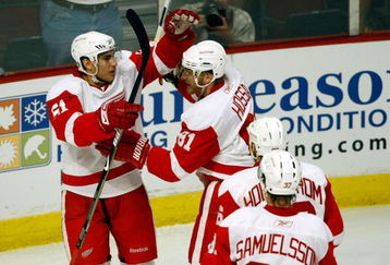 CHICAGO - MAY 24:  Valtteri Filppula #51 of the Detroit Red Wings celebrates with Marian Hossa #81, Tomas Holmstrom #96 and Mikael Samuelsson #37 after Filppula scored a goal in the second period against the Chicago Blackhawks during Game Four of the Western Conference Championship Round of the 2009 Stanley Cup Playoffs on May 24, 2009 at the United Center in Chicago, Illinois.  (Photo by Jim Prisching/Getty Images)