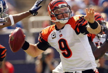 EAST RUTHERFORD, NJ - SEPTEMBER 21:  Carson Palmer #9 of the Cincinnati Bengals looks to pass as he is pressured by the New York Giants defense on September 21, 2008 at Giants Stadium in East Rutherford, New Jersey  (Photo by Elsa/Getty Images)