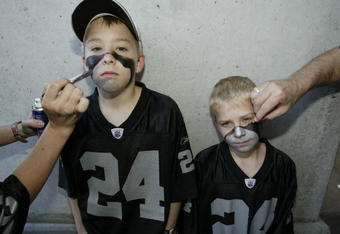 SAN DIEGO - JANUARY 26:  Fans Justin and Calvin Boller have their faces painted before the start of Super Bowl XXXVII between the Tampa Bay Buccaneers and the Oakland Raiders at Qualcomm Stadium on January 26, 2003 in San Diego, California.  The Buccaneers won 48-21.  (Photo by Donald Miralle/Getty Images)