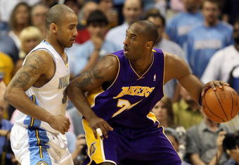 DENVER - MAY 29:  Kobe Bryant #24 of the Los Angeles Lakers posts up Dahntay Jones #30 of the Denver Nuggets in the first quarter of Game Six of the Western Conference Finals during the 2009 NBA Playoffs at Pepsi Center on May 29, 2009 in Denver, Colorado. NOTE TO USER: User expressly acknowledges and agrees that, by downloading and or using this photograph, User is consenting to the terms and conditions of the Getty Images License Agreement.  (Photo by Jed Jacobsohn/Getty Images)