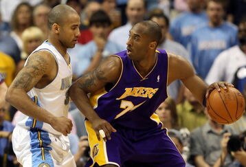DENVER - MAY 29:  Kobe Bryant #24 of the Los Angeles Lakers posts up Dahntay Jones #30 of the Denver Nuggets in the first quarter of Game Six of the Western Conference Finals during the 2009 NBA Playoffs at Pepsi Center on May 29, 2009 in Denver, Colorado. NOTE TO USER: User expressly acknowledges and agrees that, by downloading and or using this photograph, User is consenting to the terms and conditions of the Getty Images License Agreement.  (Photo by Jed Jacobsohn/Getty Images)