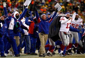 GREEN BAY, WI - JANUARY 20:  Head coach Tom Coughlin and the New York Giants celebrate as the winning field goal is kicked in overtime of the NFC championship game against the Green Bay Packers on January 20, 2008 at Lambeau Field in Green Bay, Wisconsin. The Giants defeated the Packers 23-20 in overtime to advance to the Superbowl XLII.  (Photo by Jamie Squire/Getty Images)