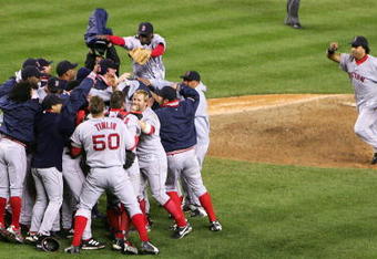 NEW YORK - OCTOBER 20:  The Boston Red Sox celebrate after defeating the New York Yankees 10-3 to win game seven of the American League Championship Series on October 20, 2004 at Yankee Stadium in the Bronx borough of New York City. (Photo by Ezra Shaw/Getty Images)