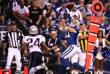 INDIANAPOLIS - NOVEMBER 02:  Anthony Gonzalez #11 of the Indianapolis Colts catches a 12-yard touchdown reception against Jonathan Wilhite #24 of the New England Patriots at Lucas Oil Stadium on November 2, 2008 in Indianapolis, Indiana.  (Photo by Andy Lyons/Getty Images)
