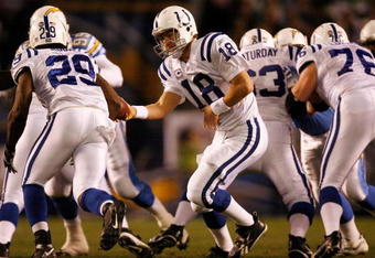SAN DIEGO - JANUARY 03:  Quarterback Peyton Manning hands the ball off to running back Joseph Addai #29 of the Indianapolis Colts against the San Diego Chargers during their AFC Wild Card Game on January 3, 2009 at Qualcomm Stadium in San Diego, California.  (Photo by Harry How/Getty Images)