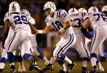SAN DIEGO - JANUARY 03:  Quarterback Peyton Manning hands the ball off to running back Joseph Addai #29 of the Indianapolis Colts against the San Diego Chargers during their AFC Wild Card Game on January 3, 2009 at Qualcomm Stadium in San Diego, California.  (Photo by Harry How/Getty Images)