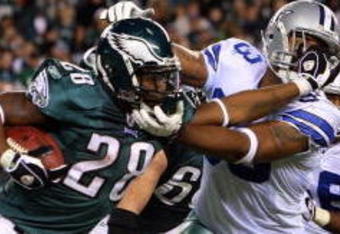 PHILADELPHIA - DECEMBER 28:  Correll Buckhalter #28 of the Philadelphia Eagles runs the ball against Anthony Spencer #93 of the Dallas Cowboys on December 28, 2008 at Lincoln Financial Field in Philadelphia, Pennsylvania. The Eagles defeated the Cowboys 44-6.  (Photo by Jim McIsaac/Getty Images)