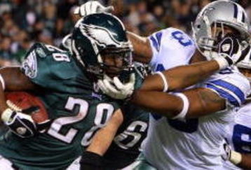 PHILADELPHIA - DECEMBER 28:  Correll Buckhalter #28 of the Philadelphia Eagles runs the ball against Anthony Spencer #93 of the Dallas Cowboys on December 28, 2008 at Lincoln Financial Field in Philadelphia, Pennsylvania. The Eagles defeated the Cowboys 44-6.  (Photo by Jim McIsaac/Getty Images)