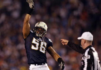 SAN DIEGO - DECEMBER 24:  Linebacker Shawne Merriman #56 of the San Diego Chargers celebrates his recovery of Quarterback Jay Cutler's #6 of the Denver Broncos fumble of the ball from the pressure of Luis Castillo #93 of the Chargers during the first half of their NFL game at Qualcomm Stadium December 24, 2007 in San Diego, California.  (Photo by Donald Miralle/Getty Images)