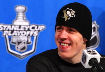 RALEIGH, NC - MAY 23:  Evgeni Malkin #71 of the Pittsburgh Penguins smiles as he talks to the media after their 6-2 win over the Carolina Hurricanes in Game Three of the Eastern Conference Championship Round of the 2009 Stanley Cup Playoffs at RBC Center on May 23, 2009 in Raleigh, North Carolina.  (Photo by Jim McIsaac/Getty Images)