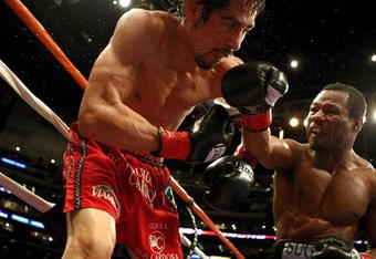 LOS ANGELES - JANUARY 24:   Shane Mosley lands a punch on Antonio Margarito en route to his TKO in the ninth round after Margarito's corner threw in the towel during their WBA welterweight title fight on January 24, 2009 at the Staples Center in Los Angeles, California. (Photo by Donald Miralle/Getty Images)