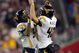 GLENDALE, AZ - JANUARY 02:  (L-R) Quarterback Patrick White #5 of the West Virginia Mountaineers and kicker Pat McAfee #40 celebrate the 79-yard touchdown catch thrown by White to Tito Gonzales #83 in the fourth quarter against the Oklahoma Sooners at the Tostito's Fiesta Bowl at University of Phoenix Stadium January 2, 2008 in Glendale, Arizona.  (Photo by Doug Pensinger/Getty Images)